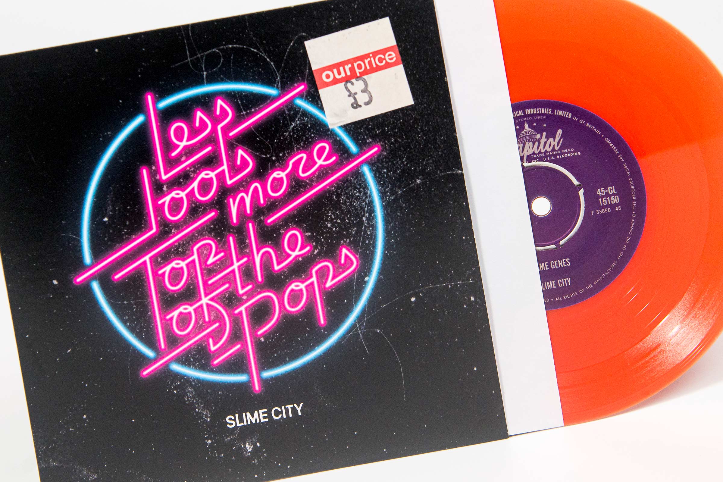 7" orange vinyl with press out centre hole in printed sleeve with inner