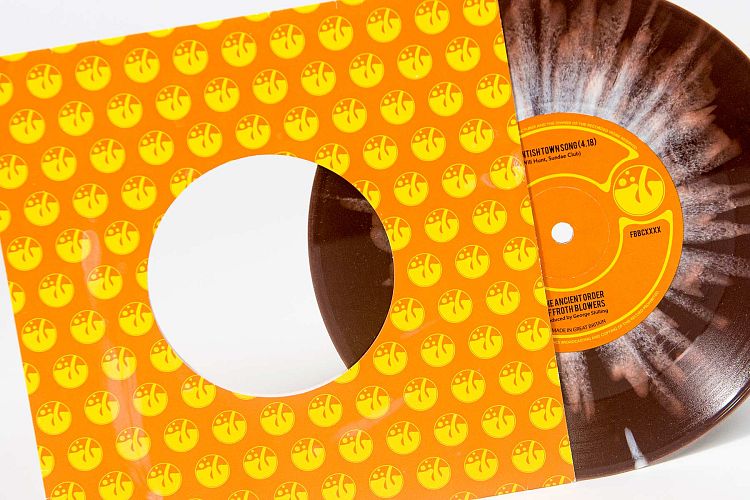 7" splatter vinyl in sleeve with centre hole.