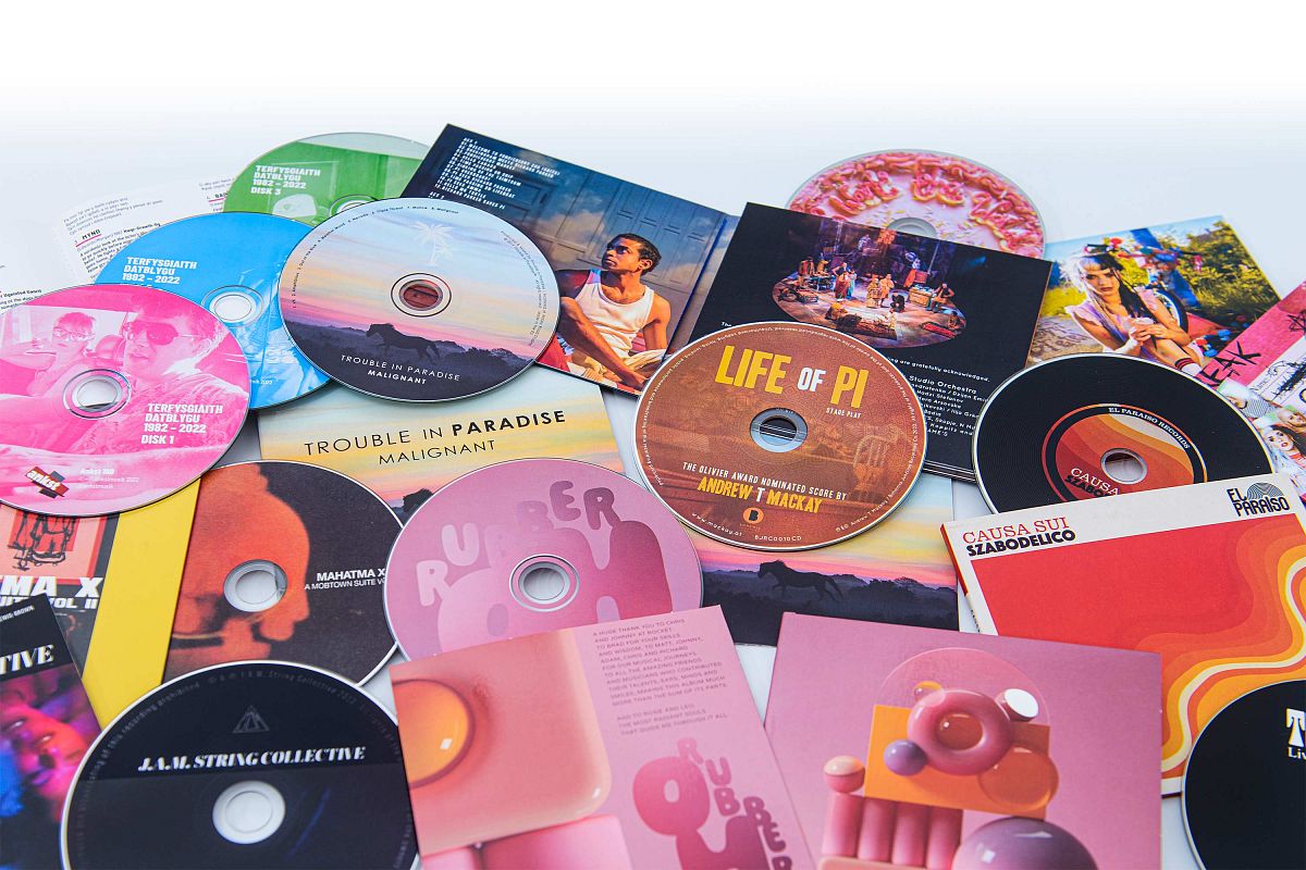 Selection of CDs in card wallets, digisleeves and digipaks packaging..