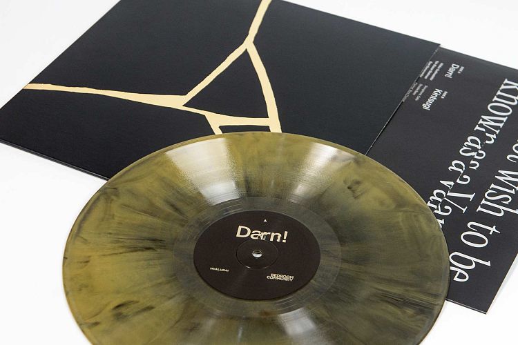 Special vinyl in sleeve with gold hot foiling.