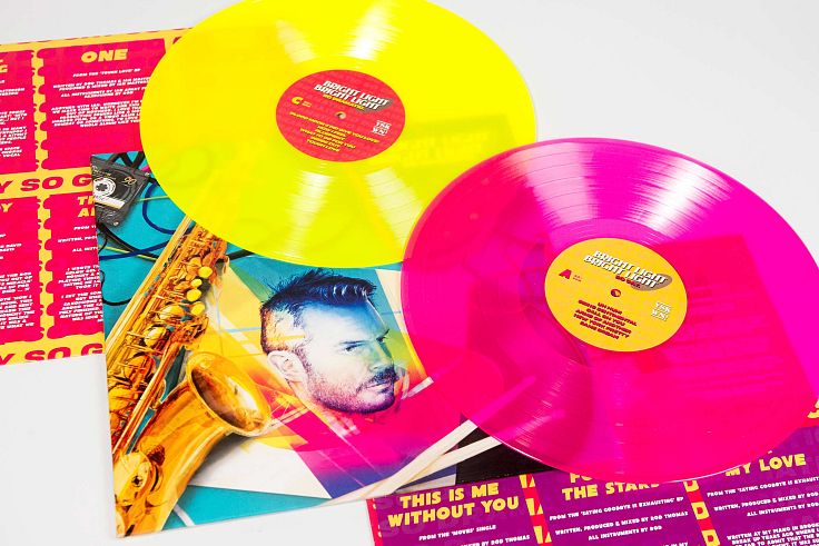 Flouro vinyl wrapped in flouro artwork with insert.