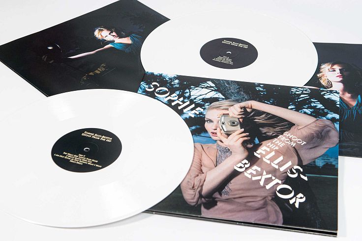 Double gatefold with printed inners and white vinyl.