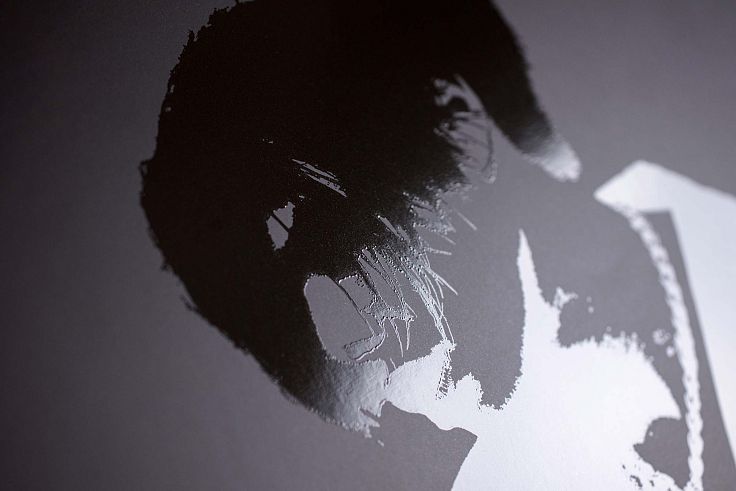 Black on black is a classic technique that uses a gloss spot varnish to pick out the design from a matt surface.