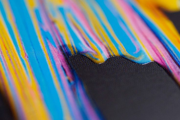 Combining embossing with gloss UV to increase the dripping paint effect.