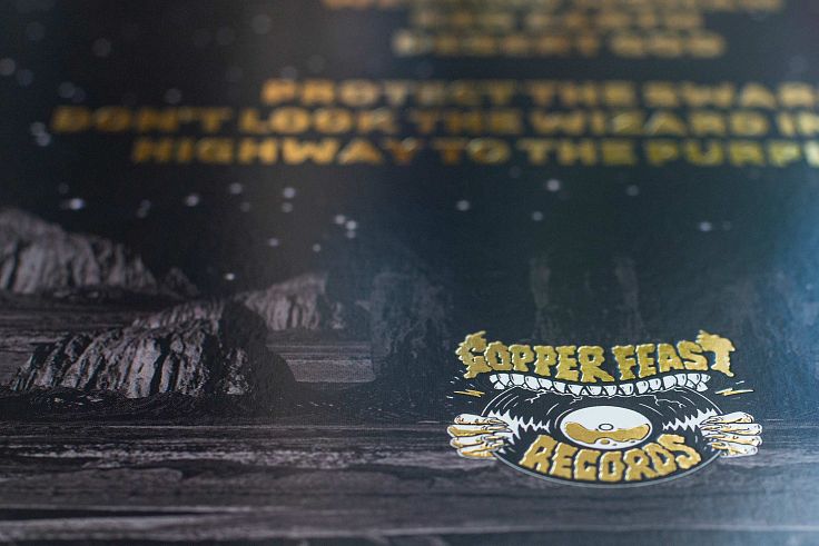 Gold foil and debossed text for Copper Feast