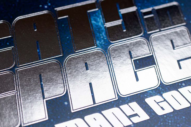 The Cats in Space logo pops out here in silver foil blocking and compliments the metal cat character of the artwork.