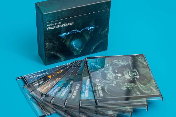 Flip top box for multiple CDs