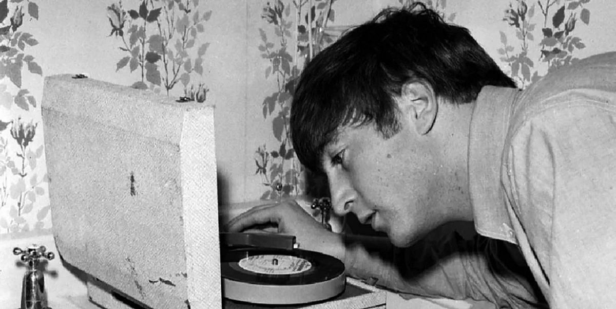 John Lennon listens to a test pressing of Twist and Shout