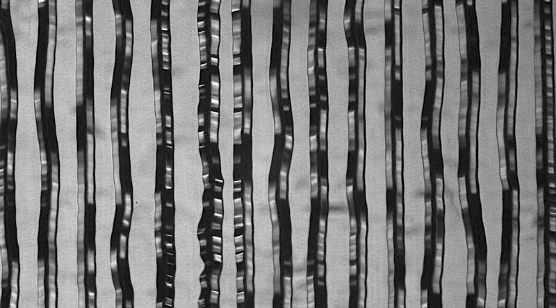 Under a microscope the modulation in the grooves of a record stamper become visible