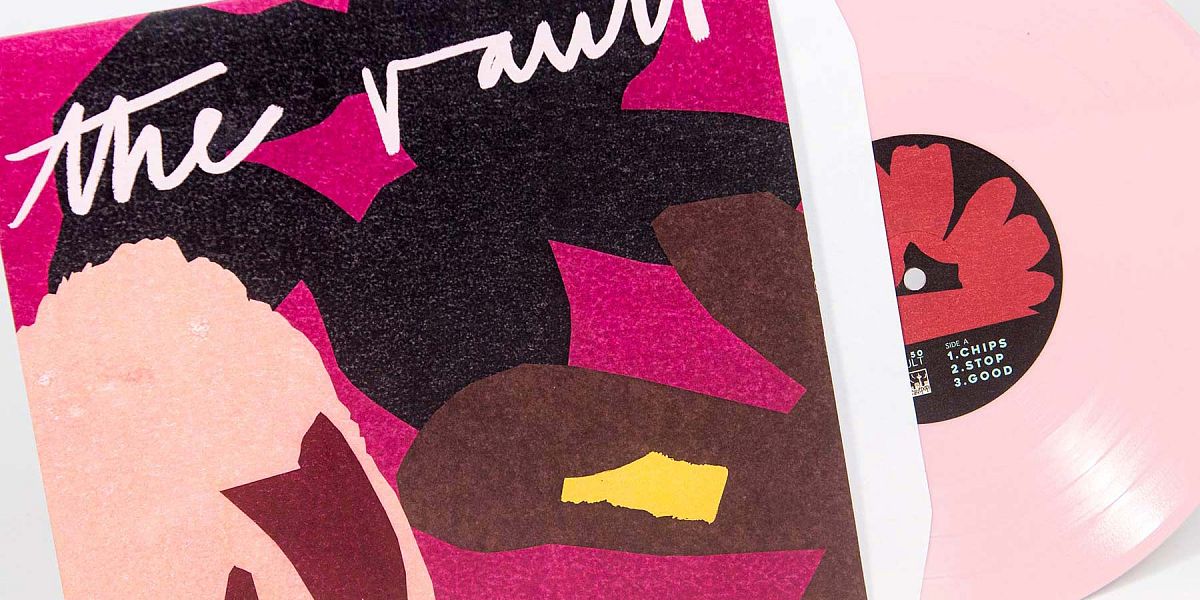 Pink vinyl record in colourful sleeve